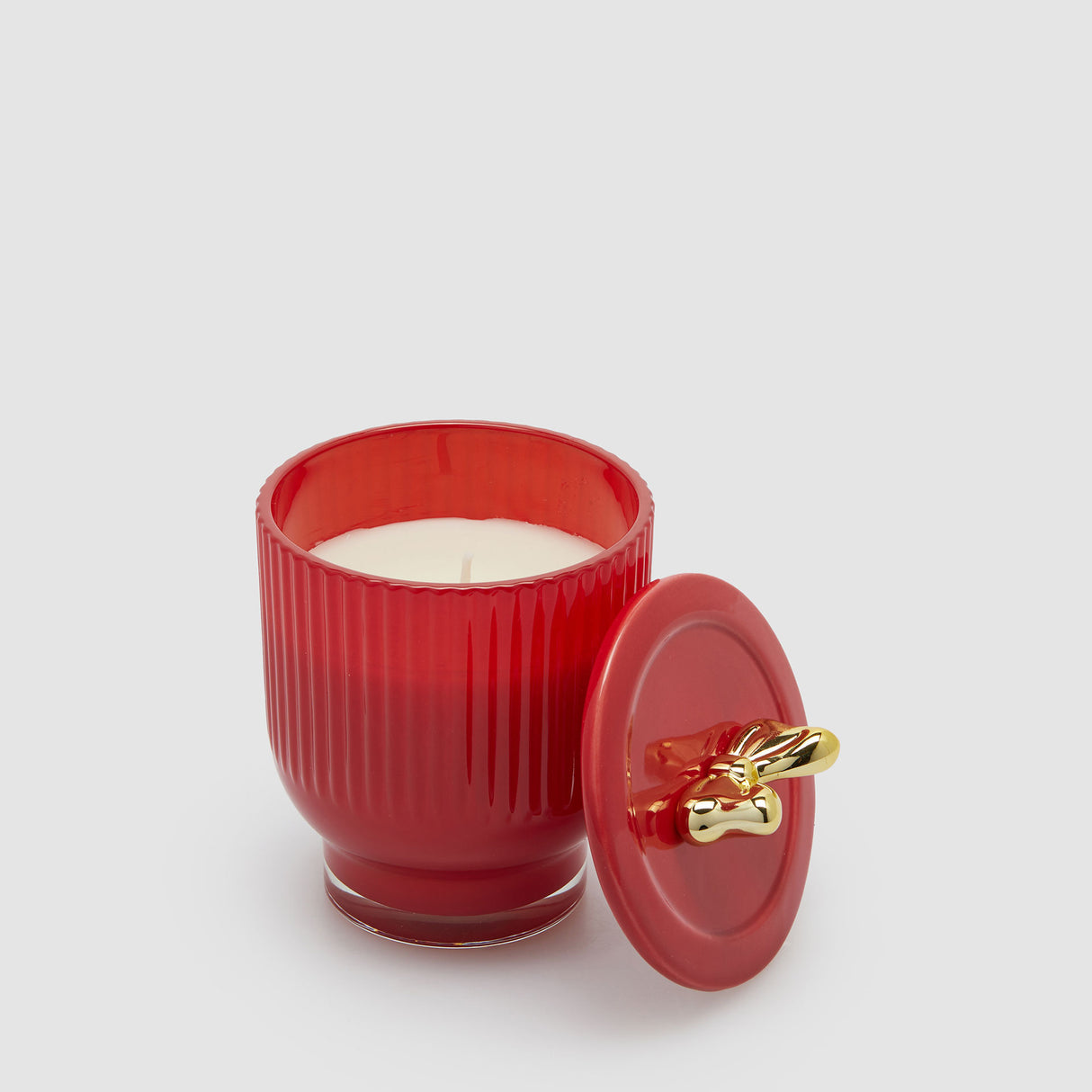 Candela profumata EDG in ceramica rossa con decoro fiocco 13x9 cm