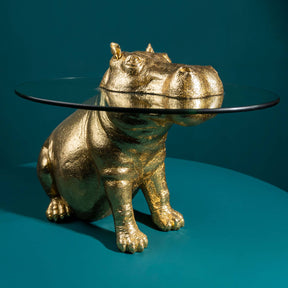 Tavolino ippopotamo Werns in resina dorata con piano in vetro 45x64 cm