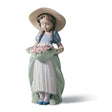 Statuetta Bimba del Prato Lladrò in porcellana con fiori 24x13 cm
