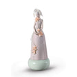 Scultura Donna Haute Allure Lladrò in porcellana opaca con fiori 38x15 cm