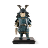 Statuina Bambino Samurai Lladrò in porcellana blu e argento 36x21 cm
