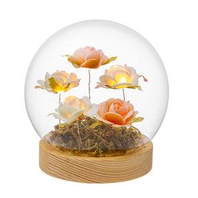 Sfera in vetro Palais Royal con rose arancio e bianche e base in legno