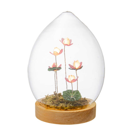 Uovo con fiori di loto Palais Royal in vetro LED su base in legno 17 cm