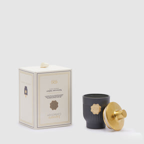 Candela profumata EDG in vetro grigio Moroccan Amber 12x7,5 cm