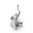 Statuina Elefante Bebè con Fiore Lladrò in porcellana lucida 14x12x10 cm