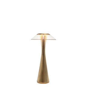 Lampada da tavolo Space Kartell in PMMA finitura oro 30 cm