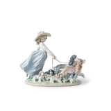 Statuina Bimba con Cani Lladrò in porcellana dai toni pastello 24x31 cm